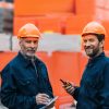 two-builders-in-helmets-working-with-walkie-talkie-2021-08-31-22-09-20-utc-1